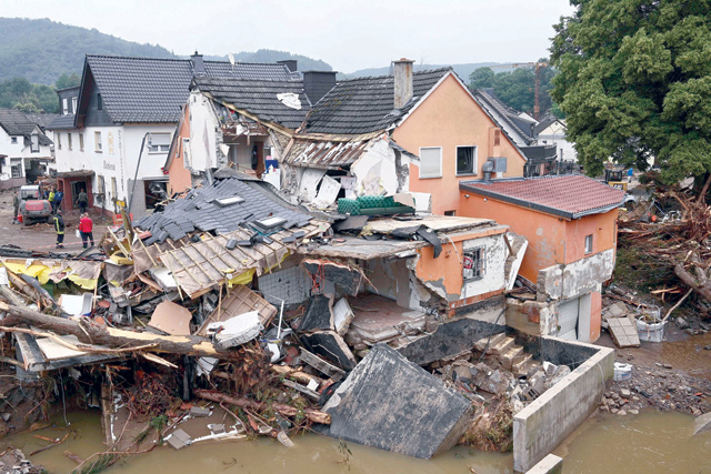 In this file photo taken on July 16, a destroyed house is photographed after floods caused major damage in Schuld near Bad Neuenahr-Ahrweiler, western Germany (AFP photo)
