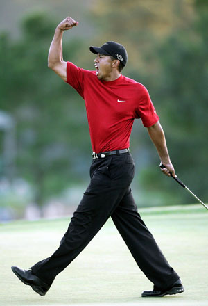 In this file photo taken on April 10, 2005, Tiger Woods celebrates winning the 2005 Masters Golf Tournament Championship at the Augusta National Golf Club in Augusta, Georgia (AFP photo by Jeff Haynes) 