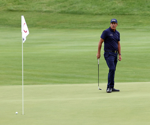 Phil Mickelson of the United States putts on the 17th green during the second round of the Travellers Championship at TPC River Highlands on Friday in Cromwell, Connecticut  (AFP photo by Rob Carr)