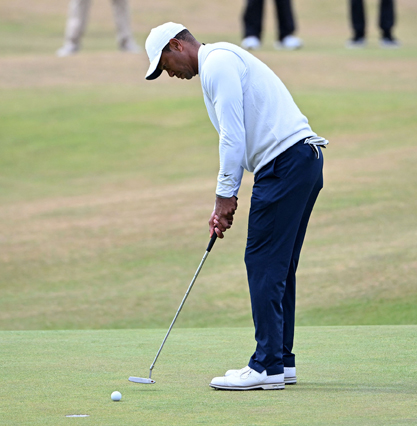 US golfer Tiger Woods putts on the 18th green at the end of his second round on day 2 of The 150th British Open Golf Championship on The Old Course at St Andrews in Scotland on Friday (AFP photo by Paul Ellis)
