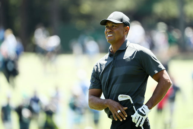 Tiger Woods of the United States plays an approach shot on the eighth hole during the first round of the 2018 Masters Tournament at Augusta National Golf Club in Augusta, Georgia,  on Thursday (AFP photo)