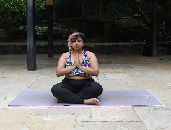 This photo taken on July 6 shows Dolly Singh, 34, doing yoga at a park in Mumbai (AFP photo by Indranil Mukherjee)