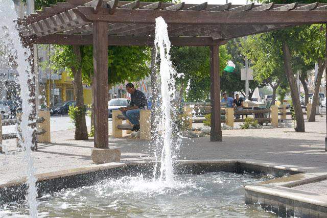 People rest in the shade at a public park in Amman in this file photo (JT file photo)