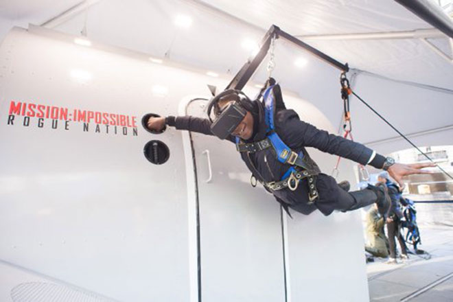 A real-life Ethan Hunt from Brooklyn experiences the ‘impossible’ by clinging to the outside of an airplane as it takes off in a virtual reality experience in New York on December 15 (AP photo by Charles Sykes)