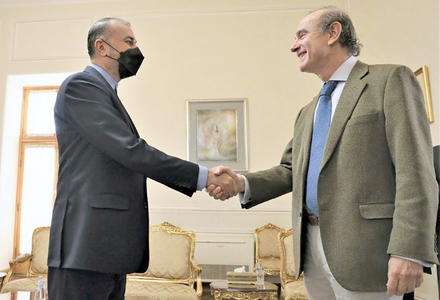 This handout photo released by the Iranian Foreign Ministry on Sunday shows Iran’s Foreign Minister Hossein Amir-Abdollahian (left) receiving Deputy Secretary General and Political Director of the European External Action Service Enrique Mora in Tehran  (AFP photo)