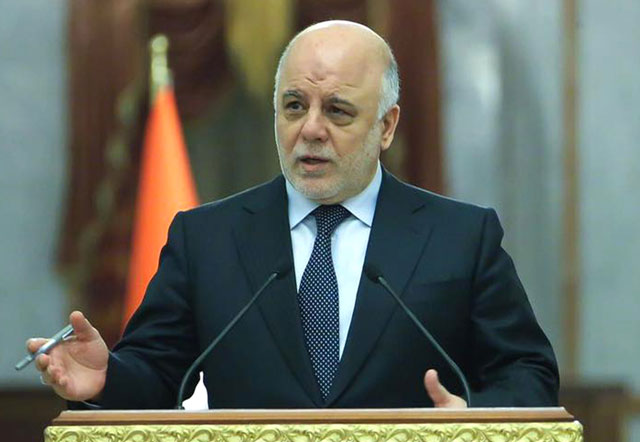 A handout photo released by the Iraqi prime minister’s press office on Tuesday, shows Iraqi Prime Minister Haidar Al Abadi (centre) speaking during an official meeting in the capital Baghdad (AFP photo)