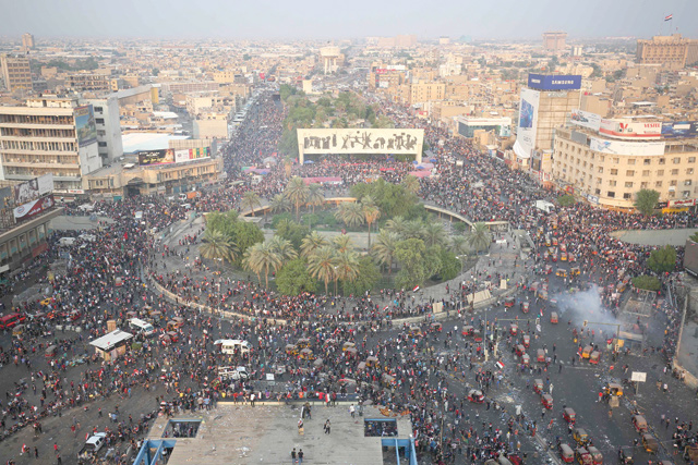 Iraqi demonstrators gather at Tahrir Square in Baghdad during ongoing anti-government demonstrations on Monday (AFP photo)