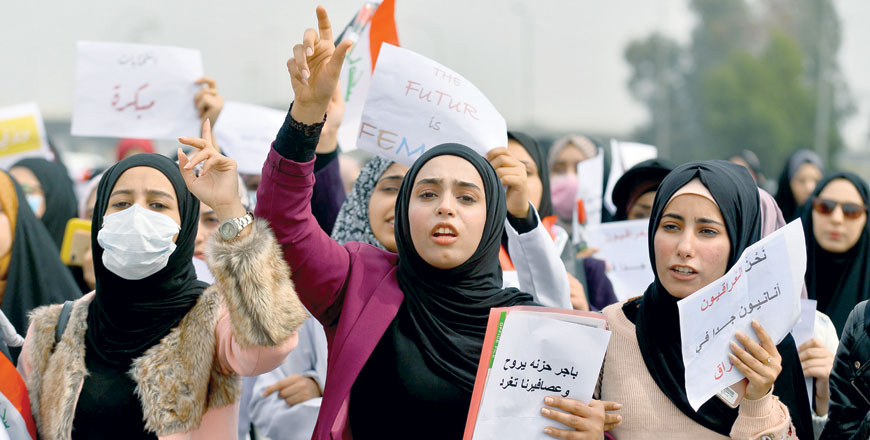 Iraqi women chant as they take part in an anti-government protest in the central city of Najaf on Wednesday (AFP photo)
