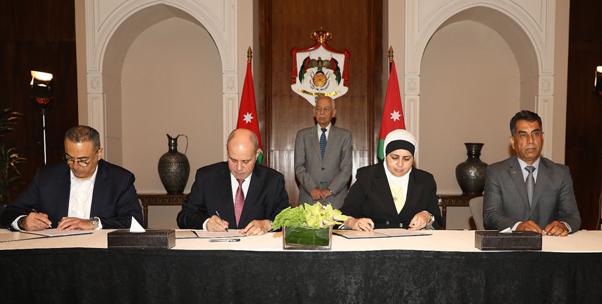Royal Court Chief Yousef Issawi presides over a signing ceremony of agreements meant to establish new branches of factories and companies in Ajloun, Mafraq, Maan and Karak, expected to create a minimum of 670 job opportunities, on Monday (Petra photo)
