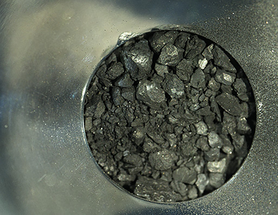 Samples of soil from the asteroid Ryugu, inside a compartment of the capsule collected by the Hayabusa-2 space probe, at the Japan Aerospace Exploration Agency’s Sagamihara Campus in Sagamihara, Kanagawa prefecture on December 24, 2020 (Photo courtesy of Japan Aerospace Exploration Agency)