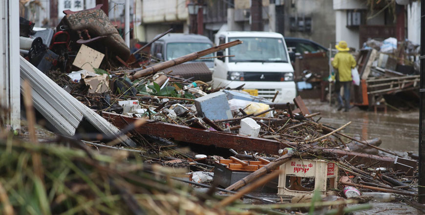 This photo shows a street covered by debris in a flood-affected area following torrential rain in Hitoyoshi, Kumamoto prefecture, on Sunday (AFP photo)