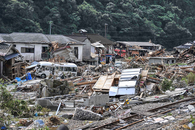 Debris litter a village following heavy rain in Kuma-mura, Kumamoto prefecture, on Wednesday  (AFP photo)