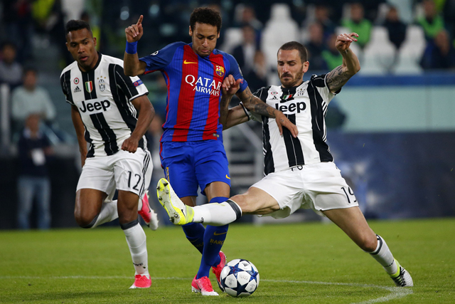Barcelona’s forward Neymar (centre) fights for the ball with Juventus’ defender Alex Sandro and Juventus’ defender Leonardo Bonucci (right) during the UEFA Champions League quarter-final first leg football match Juventus vs Barcelona, on Tuesday, in Turin, Italy  (AFP photo)
