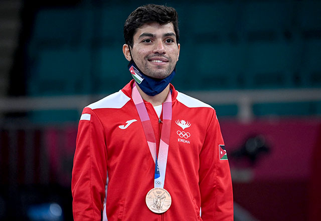 Jordan's Abdul Rahman Al Masatfa poses with his bronze medal in the men's -67kg kumite event of the karate competition at a ceremony during the Tokyo 2020 Olympic Games in Tokyo on Thursday (AFP photo by Alexander Nemenov)