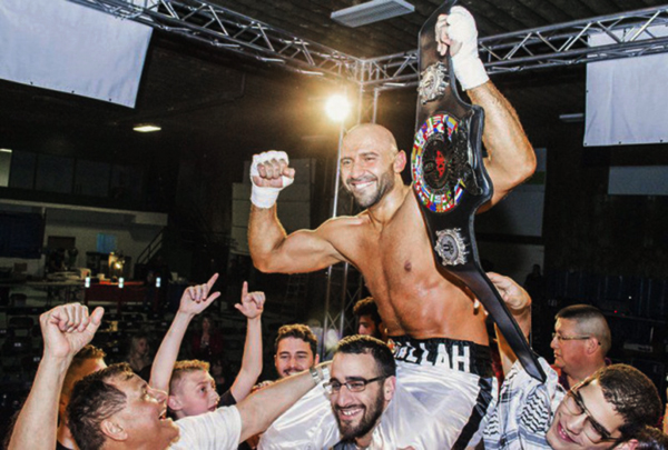 Amer Abdallah celebrates his World Kickboxing Association world championship victory in the ring on Saturday night at the Kenan Centre Arena in Lockport, New York (Photo courtesy of Lace Up Promotions)