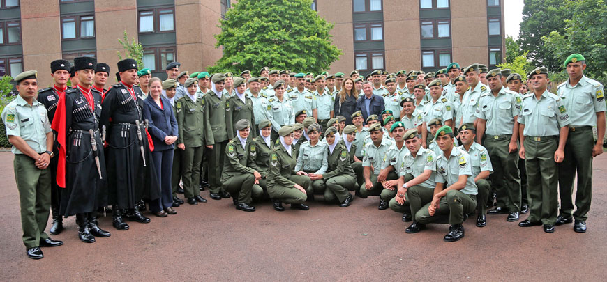   Their Majesties King Abdullah and Queen Rania with Jordan Armed Forces-Arab Army personnel who participated in the 2016 Royal Edinburgh Military Tattoo in Scotland, which opened on Friday and continues through August 27 (Photo courtesy of Royal Court)