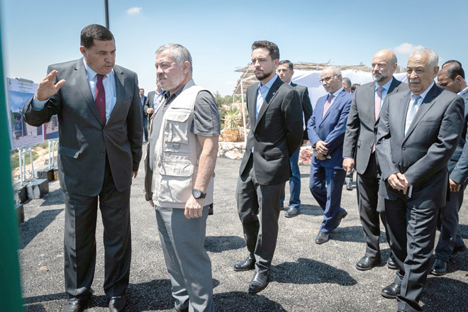 His Majesty King Abdullah and HRH Crown Prince Hussein check on the designs of the Ajloun cable car project during a visit to the northern governorate on Tuesday (Photo courtesy of Royal Court)
