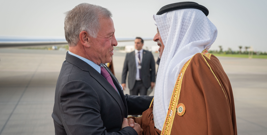His Majesty King Abdullah is received by Bahrain Crown Prince and Prime Minister Salman Bin Hamad Al Khalifa upon arrival at Sakhir Air Base (Photo courtesy of Royal Court)