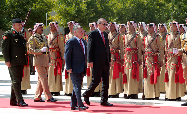 His Majesty King Abdullah receives Turkish President Recep Tayyip Erdogan upon his arrival in Amman on Monday  (Photo courtesy of Royal Court)