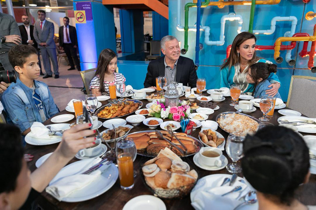 Their Majesties King Abdullah and Queen Rania host an Iftar on Wednesday for a group of orphans at the Children’s Museum-Jordan (Photo courtesy of Royal Court)