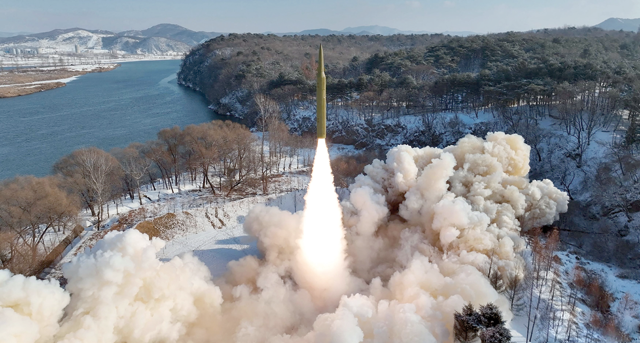 This photo taken on Sunday and released from North Korea's official Korean Central News Agency via KNS on Monday shows the test-firing of an intermediate-range solid-fuel ballistic missile at an unconfirmed location in North Korea (AFP photo)
