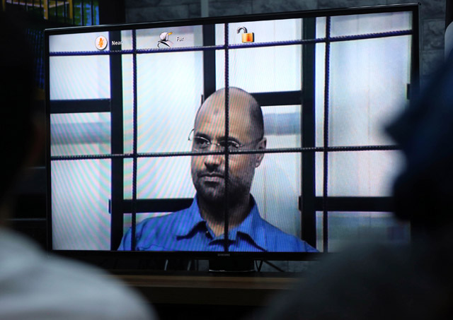 This file photo taken in Tripoli on April 27, 2014, shows Seif Al Islam, the son of slain Libyan dictator Muammar Qadhafi, answering judges’ questions during a live broadcast from the western Libyan city of Zintan (AFP photo)