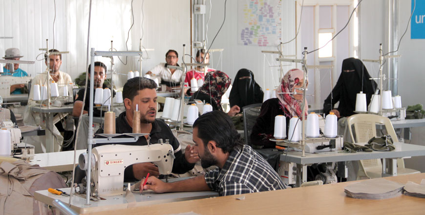 Syrian workers are seen working in a garment training factory in Mafraq recently (Photo by Camille Dupire)