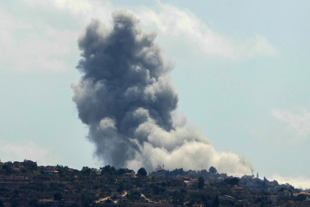 Smoke billows from the site of an Israeli airstrike that targeted the southern Lebanese village of Houla on September 16, 2024 (AFP photo)