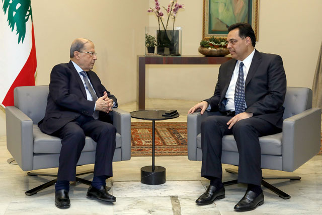 Lebanese President Michel Aoun (left) meets with prime minister-designate Hassan Diab at the presidential palace in Baabda, east of the capital Beirut (AFP photo)
