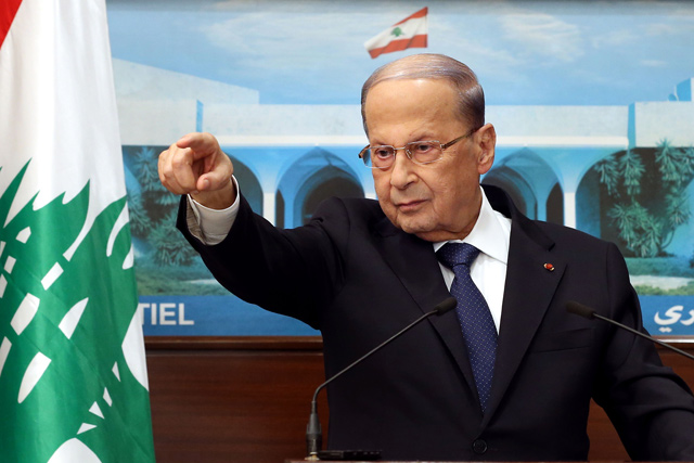 This handout photo provided by the Lebanese photo agency Dalati and Nohra on Monday shows President Michel Aoun talking to the press at the presidential palace in Baabda, east of the capital, regarding ongoing consultations to form a new Cabinet (AFP photo)