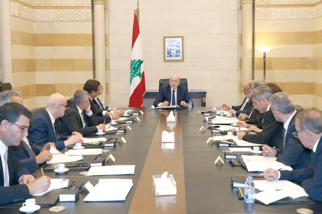 A handout photo provided by the Lebanese photo agency Dalati and Nohra on Monday shows Lebanon's Prime Minister Najib Mikati heading a ministerial council at the Grand Serail (Government Palace) in the capital Beirut (AFP photo)