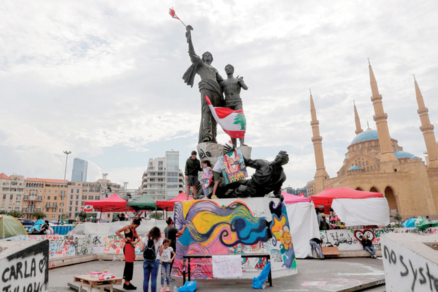 Lebanese protesters gather around Martyrs Square monument in Lebanon's capital Beirut during ongoing anti-government demonstrations on Monday (AFP photo)