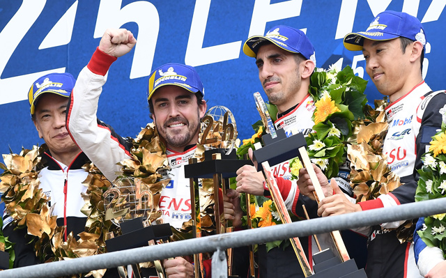 Toyota TS050 Hybrid LMP1 of Japanese’s driver Kazuki Nakajima (right) Spain’s driver Fernando Alonso (2nd left) and Switzerland’s driver Sebastien Buemi (2nd right) celebrate on podium after winning in the 87th edition of the 24 hours Le Mans endurance race in Le Mans, France, on Sunday  (AFP photo by Fred Tanneau)