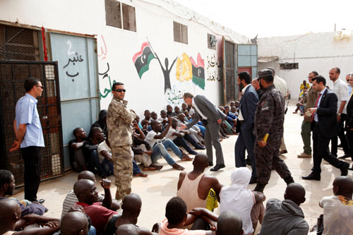 UN Special Representative and Head of the United Nations Support Mission in Libya Martin Kobler shakes hands with one of the illegal immigrants at Abu Saleem detention centre for illegal immigrants in Tripoli, on Thursday (Reuters photo)