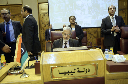 Libyan Foreign Affairs Minister Mohamed Taher Siala (centre) attends a meeting of Arab foreign ministers to discuss a French peace initiative in the Egyptian capital Cairo, on Saturday (AFP photo)