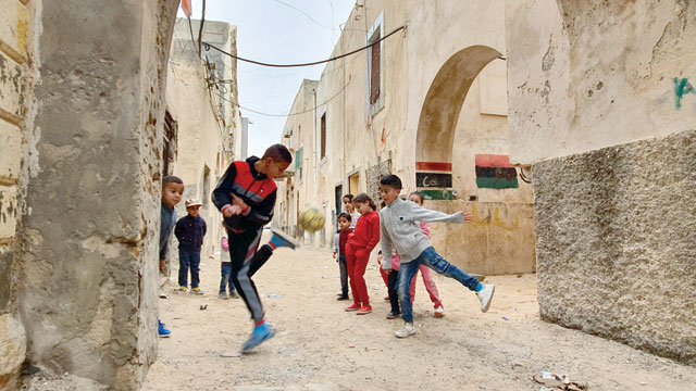 Libyan children play on Tuesday in the Libyan capital Tripoli, controlled by the UN-recognised Government of National Accord (AFP photo)