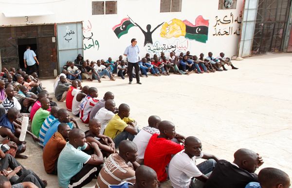 Illegal migrants sit at the Abu Saleem detention centre in Tripoli, Libya, May 19 (Reuters photo)