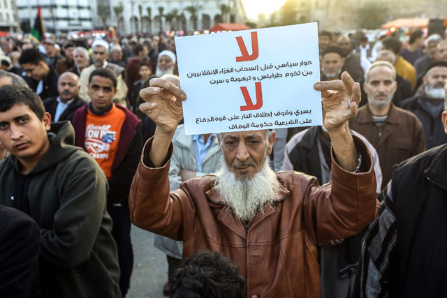 Demonstrators take part in a rally against eastern Libyan strongman Khalifa Haftar and in support of the UN-recognised government of national accord (GNA) in Martyrs' Square in the GNA-held capital Tripoli, on Friday (AFP photo)