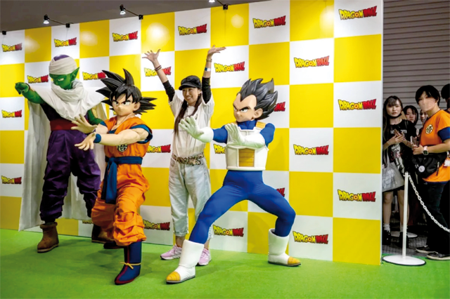 A visitor (second right) poses with the characters from Dragon Ball during the ‘Dragon Ball Daimatsuri’ event, to mark the 40th anniversary of Akira Toriyama’s Dragon Ball franchise, at the Tokyo Big Sight in Tokyo on October 6 (AFP photo)
