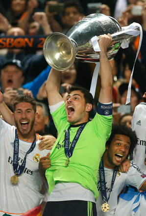 In this May 24, 2014, file photo, Real goalkeeper Iker Casillas (centre) lifts the Champions League trophy, as he and his teammates celebrate winning the Champions League title against Atletico Madrid, in Lisbon (AP photo by Andres Kudacki)