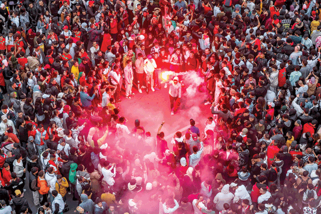 Morocco's supporters celebrate after their country's win of the Qatar 2022 World Cup football match between Morocco and Portugal, in the capital Rabat, on Saturday (AFP photo)