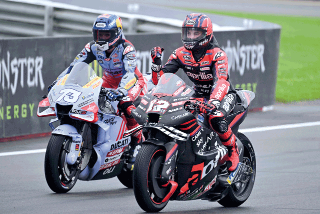 First-placed Gresini Racing MotoGP’s Spanish rider Alex Marquez and third-placed Aprilia Racing’s Spanish rider Maverick Vinales (right) celebrate after crossing the finish line in the Moto GP sprint race of the British Grand Prix t in Northamptonshire on Saturday (AFP photo by Ben Stansall)