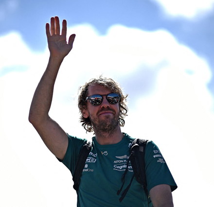 Aston Martin’s German driver Sebastian Vettel waves to fans as he arrives ahead of the Formula One British Grand Prix in Silverstone on July 3 (AFP photo by Ben Stansall)