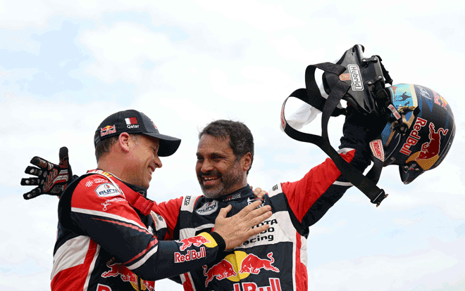 Toyota’s driver Nasser Al Attiyah of Qatar and his co-driver Mathieu Baumel (left) of France celebrate winning the 2023 Dakar Rally in Dammam, Saudi Arabia, on Sunday (AFP photo by Franck Fife)