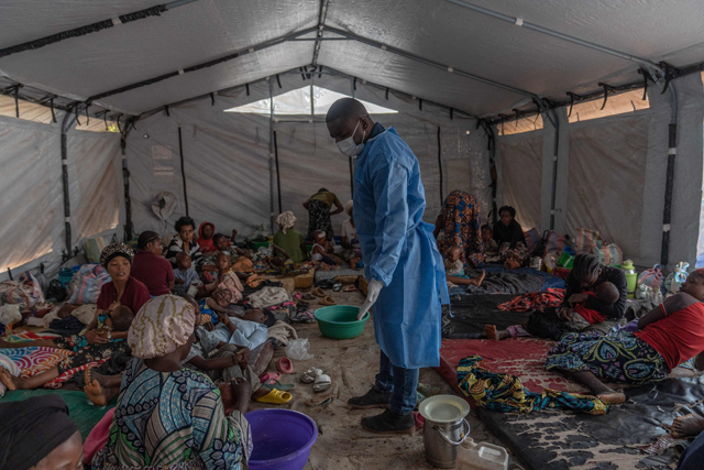 Doctor Robert Musole, medical director of the Kavumu hospital, visits patients recovering from mpox in the village of Kavumu, 30km north of Bukavu in eastern Democratic Republic of Congo on August 24 (AFP photo)