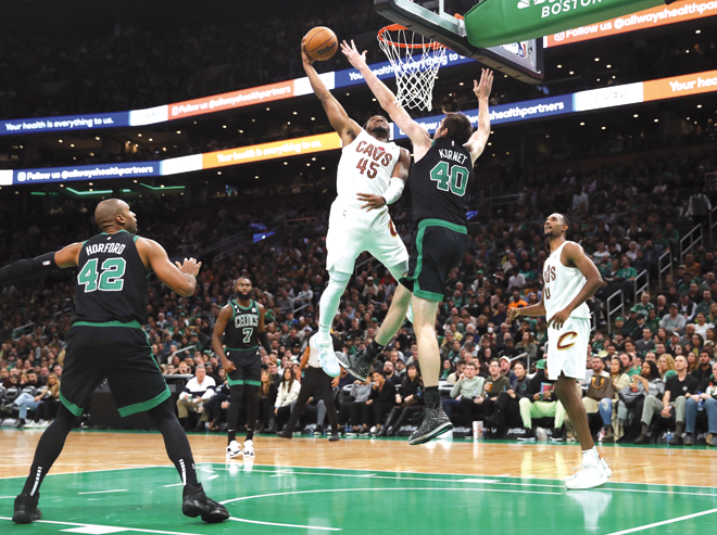 Donovan Mitchell of the Cleveland Cavaliers takes a shot against Luke Kornet of the Boston Celtics during their NBA game in Boston, Massachusetts, on Friday (AFP photo by Maddie Meyer)