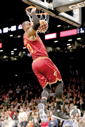 Cleveland Cavaliers’ LeBron James dunks against the Brooklyn Nets during their NBA game in the New York City on Friday  (AFP photo)