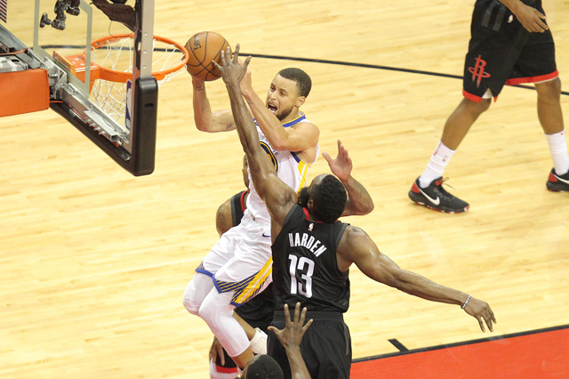 Golden State Warriors guard Stephen Curry shoots over Houston Rockets guard James Harden during the Western conference finals of the 2018 NBA play-offs in Houston, Texas, on Monday  (Reuters photo by Erik Williams)
