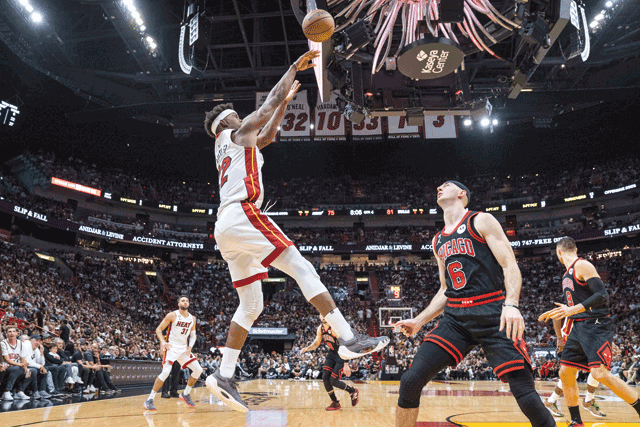 Jimmy Butler of the Miami Heat shoots the ball over Alex Caruso of the Chicago Bulls during their NBA game in Miami, Florida, on Friday (AFP photo by Bryan Cereijo)
