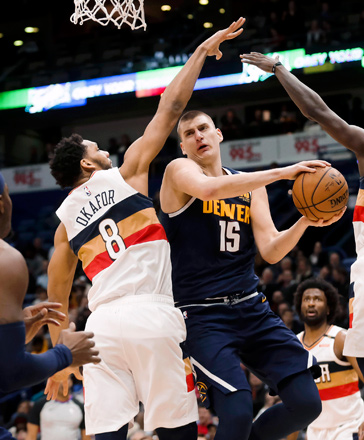 Denver Nuggets centre Nikola Jokic is defended by New Orleans Pelicans centre Jahlil Okafor during their NBA game in New Orleans, Louisiana, on Wednesday (Reuters photo by Derick E. Hingle)